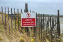 A sign prohibiting entry to a site due to the presence of Japanese Knotweed