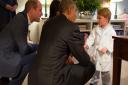 Handout photo issued by Kensington Palace of Prince George (right) meeting the President of the United States Barack Obama (centre) and  First Lady Michelle Obama (behind) at Kensington Palace, London, with the Duke of Cambridge (left). PRESS ASSOCIATION 