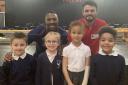Peter Bakare and Gianni Frankis with pupils from Rush Green Primary School. Picture: Bethany Deer
