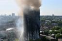 Smoke billows from a fire that has engulfed the 24-storey Grenfell Tower in west London. Picture: PA/Victoria Jones