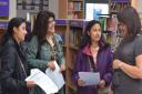 Shahla (far left) and Shakila Khandcar and their mum discuss the twins' results with head of sixth form Helen Livermore