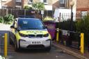 Police at the scene of a murder on Globe Road Bethnal Green. Pic: Ken Mears