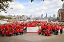 Santander employees celebrate the end of their charity ride