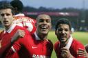 Leyton Orient players Mathieu Baudry (left), Jay Simpson (centre) and Jobi McAnuff celebrate (pic: Simon O'Connor).