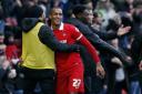 Leyton Orient forward Jay Simpson hugs his team mates on the touchline after another goal (pic: Simon O'Connor).