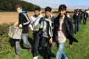 Morpeth Year-10 pupils carry ammio box along trenchline of Western Front