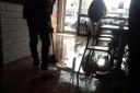 Mopping up after the flood. Picture: Highness Cafe