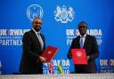 Home Secretary James Cleverly and Rwandan minister of foreign affairs Vincent Biruta sign the new treaty (Ben Birchall/PA)