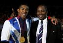 Great Britain's Anthony Joshua poses with former gold medalist Lennox Lewis following his super-heavyweight final against Italy's Roberto Cammarelle at the 2012 Olympic Games in London