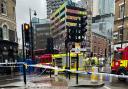 Emergency services at the scene of a fatal collision involving a pedestrian and a bus in Great Eastern Street, Shoreditch this morning
