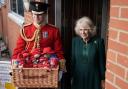 The Queen Consort delivers a basket of Paddington bears at a special teddy bears picnic at a Barnardo's Nursery in Bow