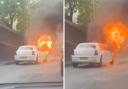 Screengrabs from a video posted to Twitter by @balanceismyname show a white limousine on fire at the side of the road