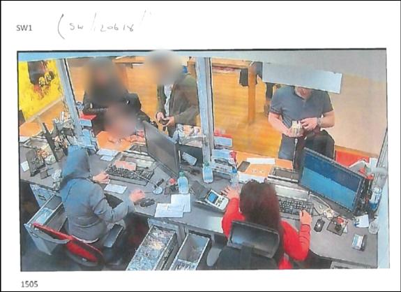 East London Advertiser: Deivis Grochiatskij depositing cash in a bank as part of a major criminal laundering operation East London Advertiser: Deivis Grochiatskij depositing cash in a bank as part of a major criminal laundering operation