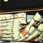 A box of cash seized from the home of Ioan Gherghel in Maryland. In total £11,385 was seized from this address.