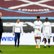 West Ham United manager David Moyes watches his players warm up prior to the Premier League match at the London Stadium, London. Picture date: Sunday February 21, 2021.