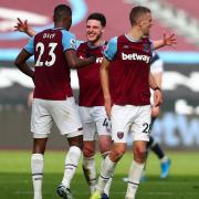 Declan Rice and Issa Diop celebrate West Ham's win over Spurs.