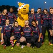 Pudsey the Children in Need mascot with members of East London Vixens