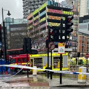 Emergency services at the scene of a fatal collision involving a pedestrian and a bus in Great Eastern Street, Shoreditch this morning