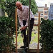 Prof Colin Bailey plants rare black poplar at Queen Mary's Mile End campus.