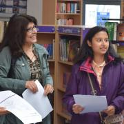 Shahla (far left) and Shakila Khandcar and their mum discuss the twins' results with head of sixth form Helen Livermore