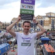 Mark Broadmore protests against the first-past-the-post voting system at Limehouse marina