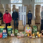 Capital Kids Cricket staff and volunteers with food items to be delivered to families in need in Newham.