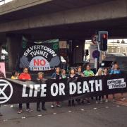 Doctors and health care workers are among those opposing the Silvertown Tunnel. Pictured here are protesters from Extinction Rebellion stopping traffic on the approach to the Blackwall Tunnel in 2019.