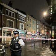 Police officers cordoned off the top of Brick Lane following the stabbing