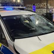 A police car damaged at the scene